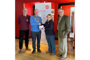 President Phil Holloway and Community Lead John Bambery present a cheque to Kathryn Casserley manager of Salvation Army, Southport